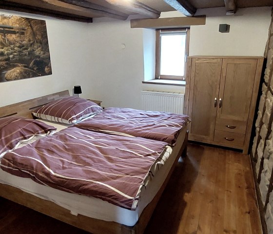 Doppelschlafzimmer mit Steinwand Doppelschlafzimmer mit Steinwand