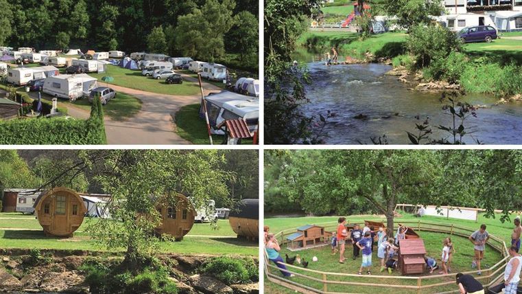 Een mooie camping met caravans en groene weilanden. Een rivier stroomt in de buurt, terwijl gezinnen en vrienden buiten tijd doorbrengen.
